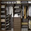 A custom built wardrobe for this walk in wardrobe uses the maximum space in the room